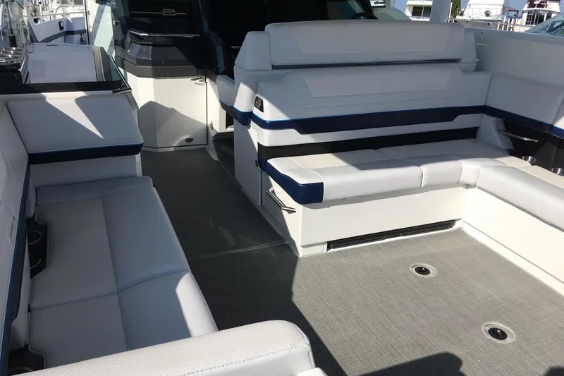 Slide: The Image of Manufacturer Provided Image: 2023 Formula 380 Super Sport Crossover OB boat interior with white and blue seating. - 14
