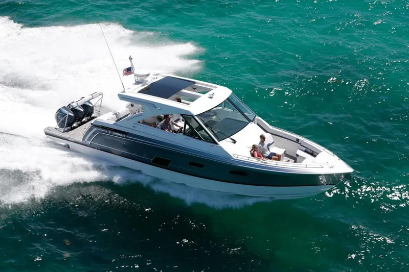 Slide: The Image of Manufacturer Provided Image: 2023 Formula 380 Super Sport Crossover OB cruising on clear blue water. - 2