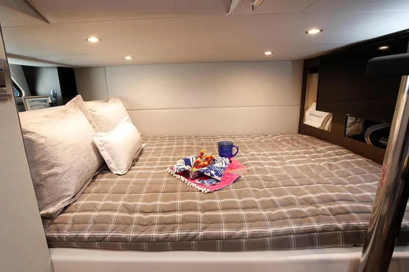 Slide: The Image of Manufacturer Provided Image: 2023 Formula 380 Super Sport Crossover OB cabin with cozy bed and breakfast setup. - 27