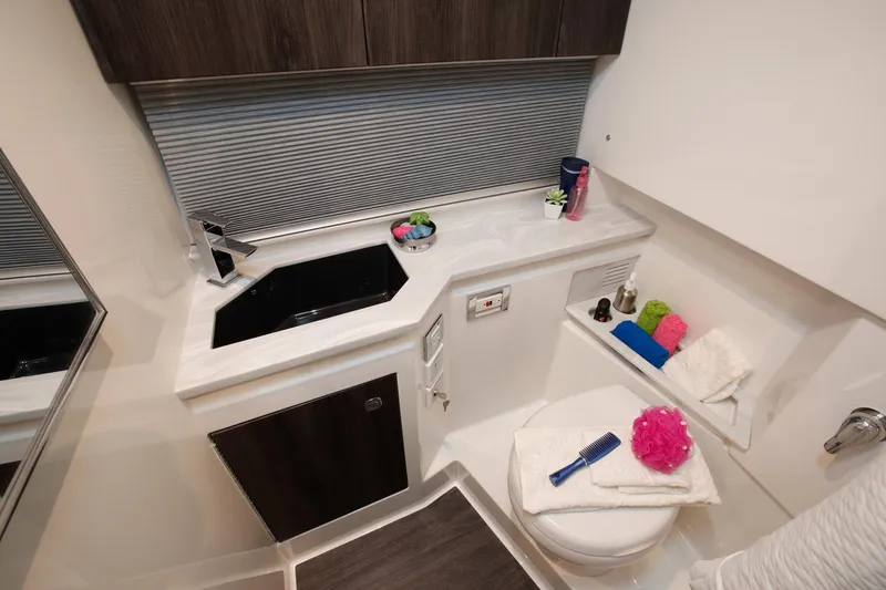 Slide: The Image of Manufacturer Provided Image: 2023 Formula 380 Super Sport Crossover OB bathroom with modern sink and toilet. - 28