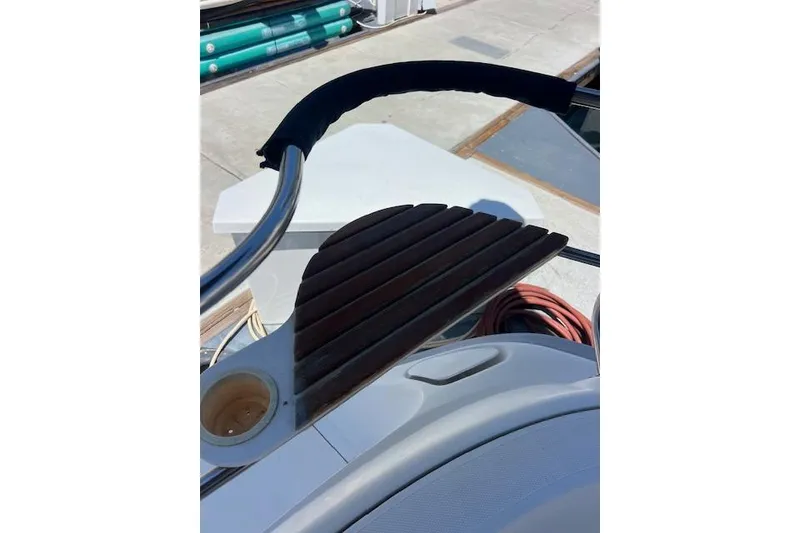 Slide: The Image of Steering wheel and wooden panel on a 1997 Hunter 430 sailboat. - 11