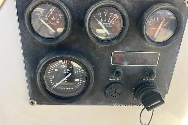 Slide: The Image of Control panel of a 1997 Hunter 430 boat with Volvo Penta gauges. - 13