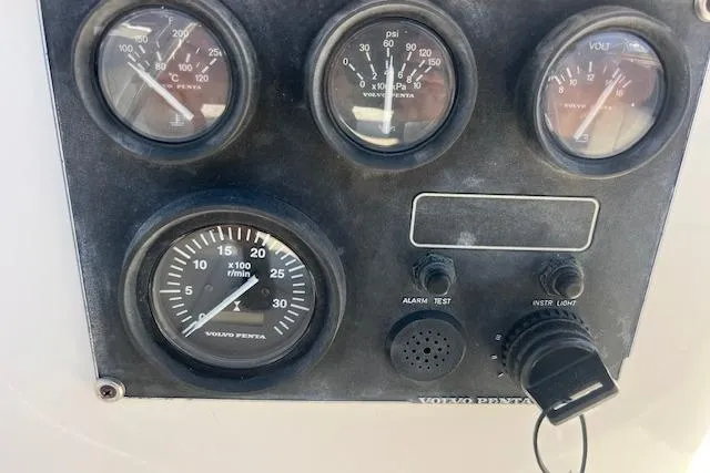 Slide: The Image of Control panel of a 1997 Hunter 430 boat with Volvo Penta gauges. - 14