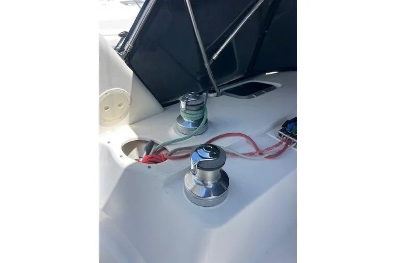Slide: The Image of Deck of 1997 Hunter 430 sailboat with winches and ropes under canopy. - 17
