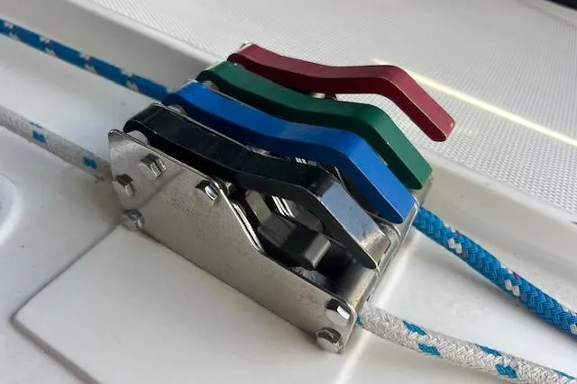 Slide: The Image of Colorful rope clutches on a 1997 Hunter 430 sailboat deck. - 19
