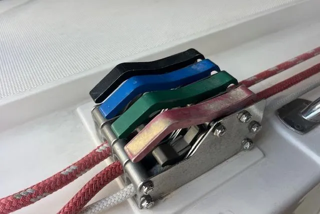 Slide: The Image of Colorful rope clutches on a 1997 Hunter 430 sailboat deck. - 20