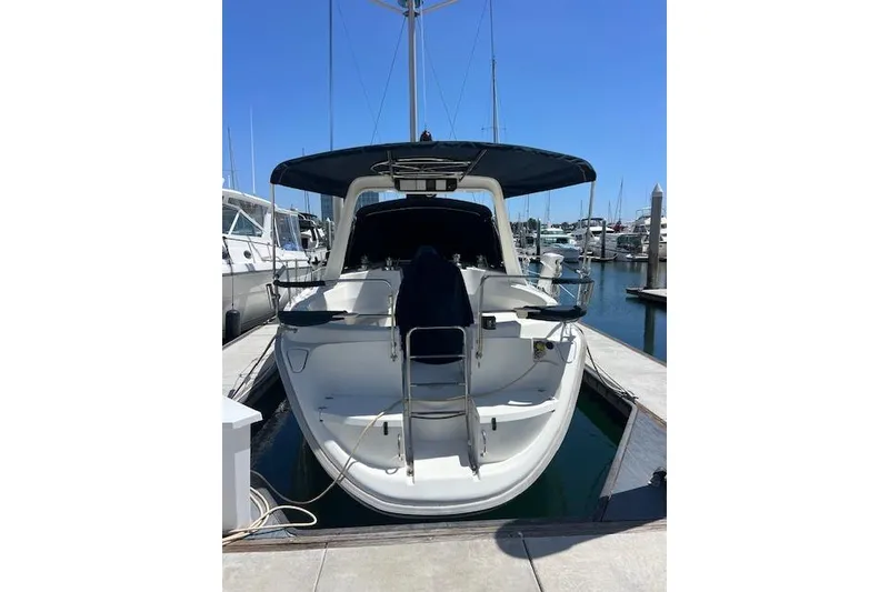 Slide: The Image of Hunter 430 sailboat from 1997 docked at a marina, rear view. - 3