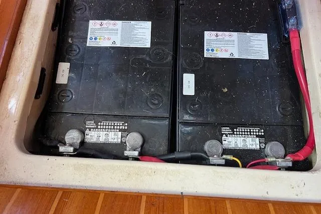 Slide: The Image of Battery compartment of a 1997 Hunter 430 sailboat with dual batteries and wiring. - 38