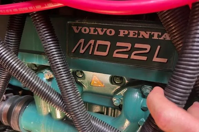 Slide: The Image of Volvo Penta MD22L engine in a 1997 Hunter 430 sailboat, featuring visible wiring and components. - 39