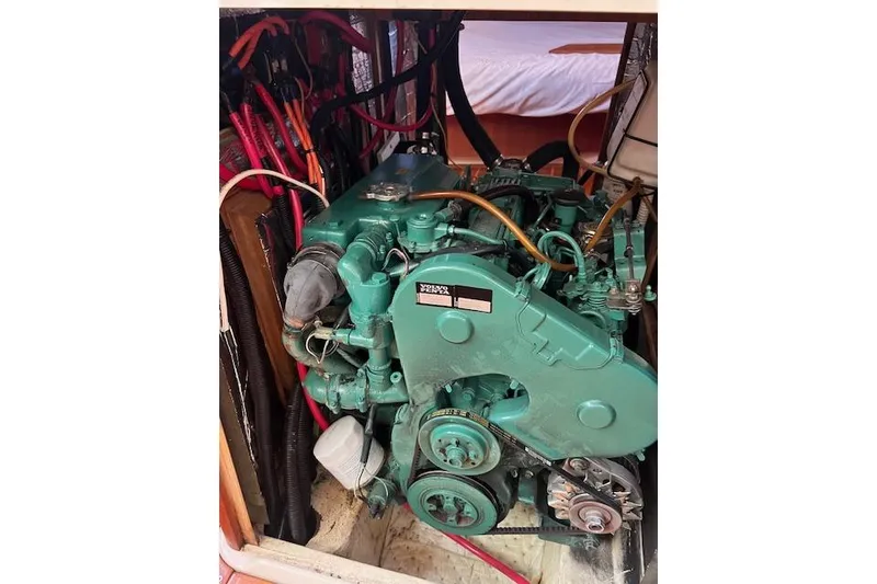 Slide: The Image of Engine compartment of a 1997 Hunter 430 sailboat with a Volvo Penta engine. - 43