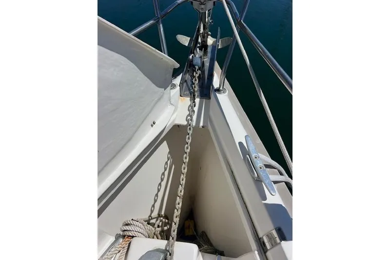 Slide: The Image of Bow of 1997 Hunter 430 sailboat with anchor chain and ropes. - 48