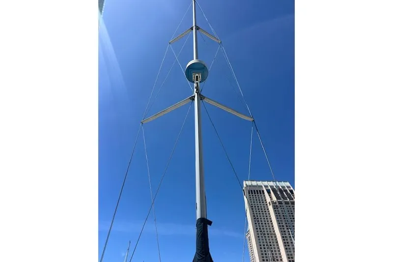 Slide: The Image of Sailboat mast of a 1997 Hunter 430 against a clear blue sky. - 51