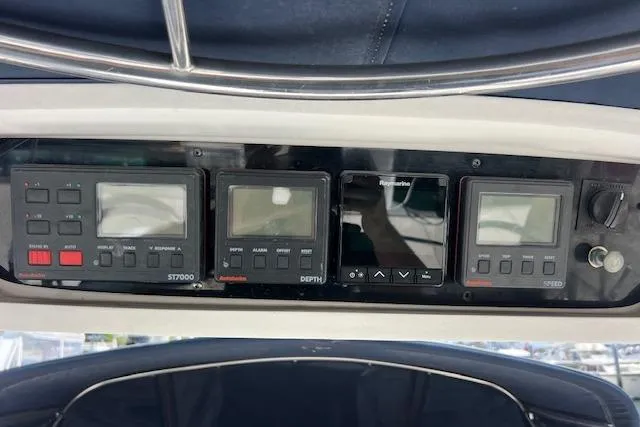 Slide: The Image of Control panel of a 1997 Hunter 430 sailboat with navigation instruments. - 8