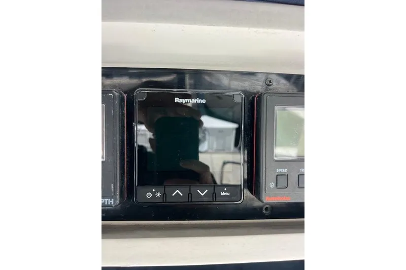 Slide: The Image of Raymarine navigation display on a 1997 Hunter 430 sailboat dashboard. - 9