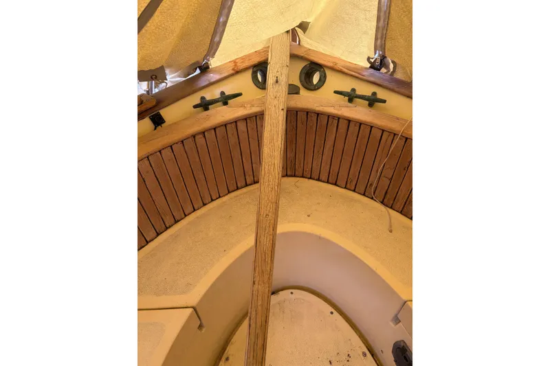 Slide: The Image of Interior view of a 1978 Pacific Seacraft 31 sailboat, featuring wooden accents and nautical details. - 11
