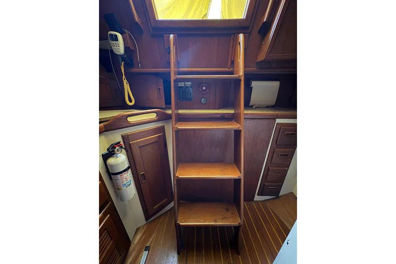 Slide: The Image of Interior of 1978 Pacific Seacraft 31 sailboat with wooden ladder and cabinetry. - 30