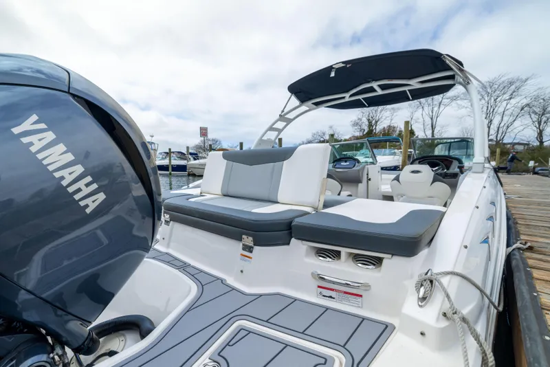 Slide: The Image of 2024 Chaparral 23 SSi OB boat with Yamaha outboard engine, docked at marina. - 10