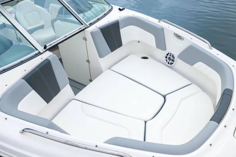 Slide: The Image of 2024 Chaparral 23 SSi OB boat interior with cushioned seating and speaker. - 12