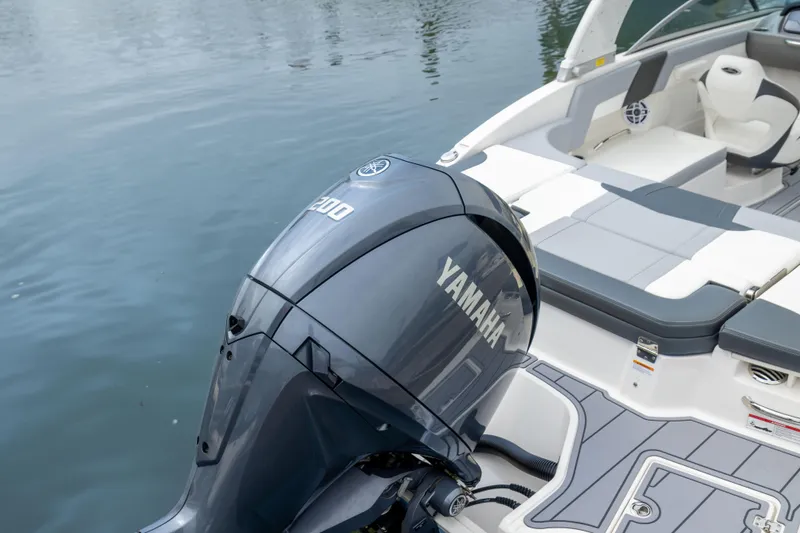 Slide: The Image of 2024 Chaparral 23 SSi OB boat with Yamaha outboard motor on calm water. - 20