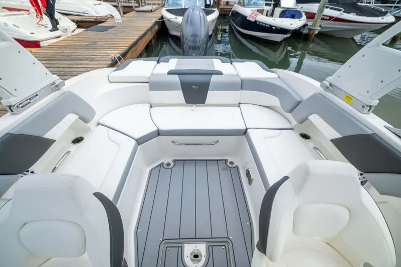 Slide: The Image of 2024 Chaparral 23 SSi OB boat interior with spacious seating and modern design. - 8