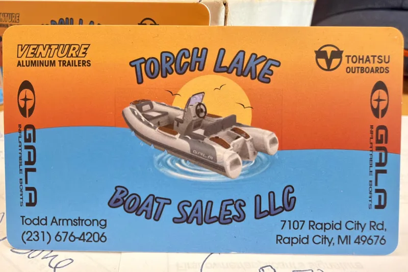 Slide: The Image of Business card for Torch Lake Boat Sales LLC featuring Gala V360 inflatable boat. - 13