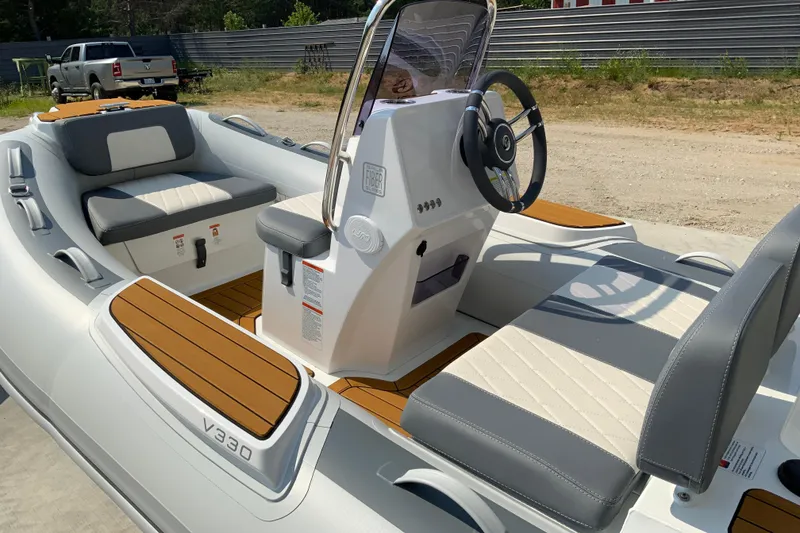 Slide: The Image of Modern Gala V360 boat interior with sleek seating and steering, 2027 model. - 5