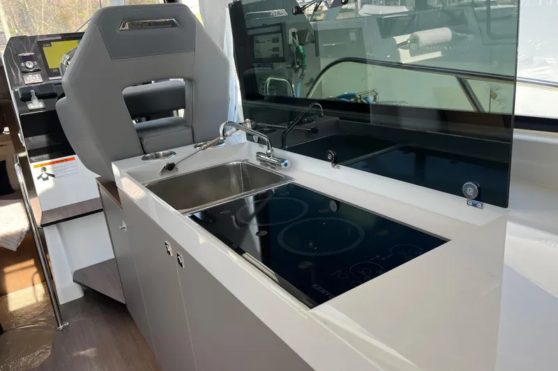 Slide: The Image of Modern kitchen area in 2026 Beneteau Antares 11 Coupe yacht with sleek design. - 17