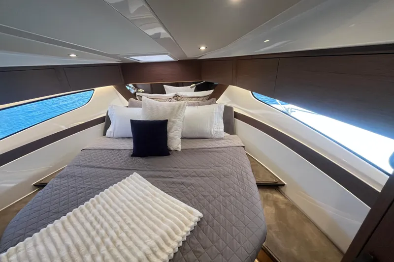 Slide: The Image of Luxurious cabin interior of 2026 Beneteau Antares 11 Coupe with elegant bedding and modern design. - 19
