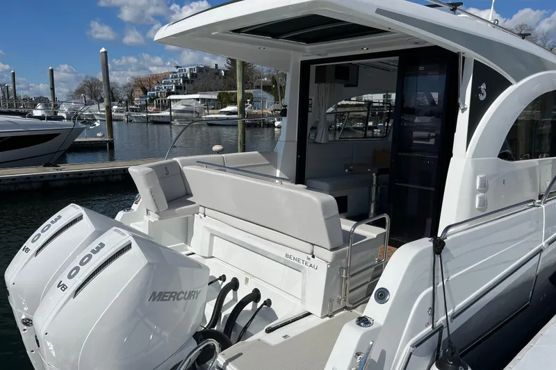 Slide: The Image of 2026 Beneteau Antares 11 Coupe docked, featuring twin Mercury outboard engines. - 3