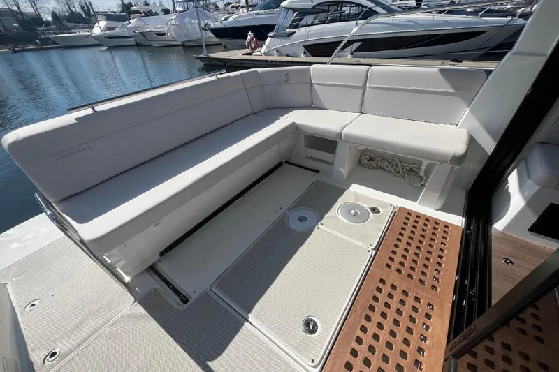 Slide: The Image of 2026 Beneteau Antares 11 Coupe boat deck with seating and storage. - 5