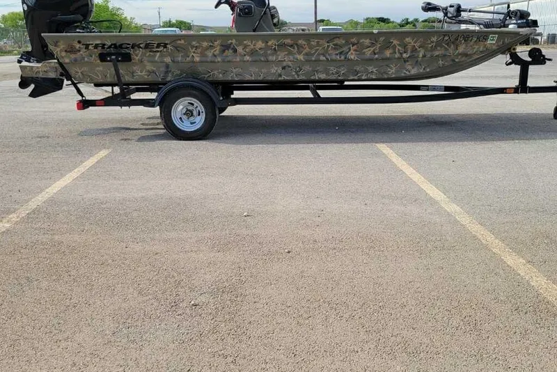 The Image of 2022 Tracker Grizzly 1860 CC boat on trailer in parking lot. - 0