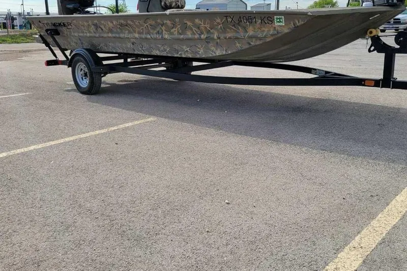 Slide: The Image of 2022 Tracker Grizzly 1860 CC boat on trailer in parking lot. - 2