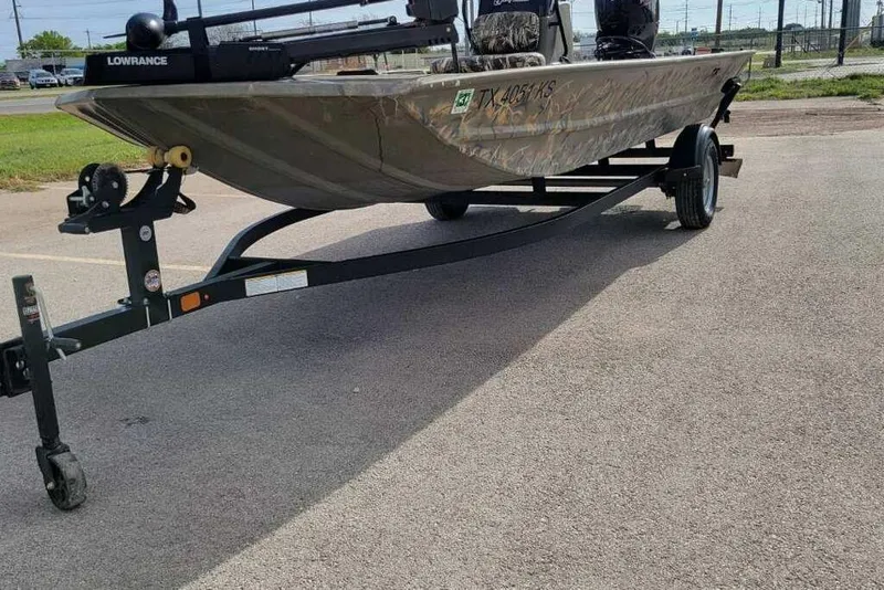 Slide: The Image of 2022 Tracker Grizzly 1860 CC boat on trailer in parking lot. - 3