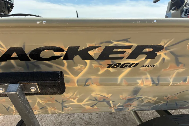 Slide: The Image of 2022 Tracker Grizzly 1860 CC boat with camouflage design and bold lettering. - 6