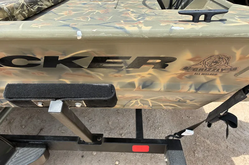 Slide: The Image of 2022 Tracker Grizzly 1860 CC boat with camouflage design and logo detail. - 7
