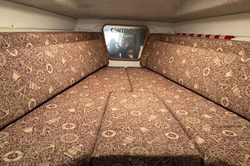 Slide: The Image of Interior cabin of 1998 Contender 35 Express Side Console with patterned upholstery. - 12