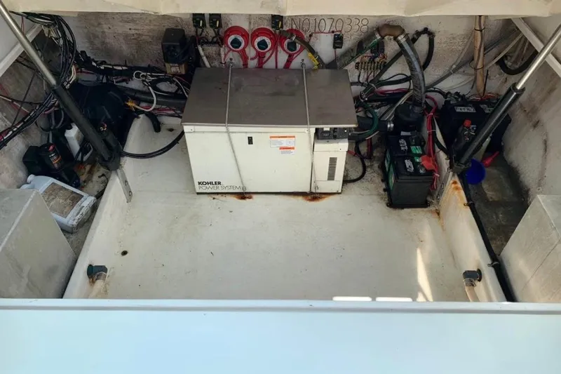 Slide: The Image of Engine compartment of a 1998 Contender 35 Express Side Console with Kohler power system. - 15