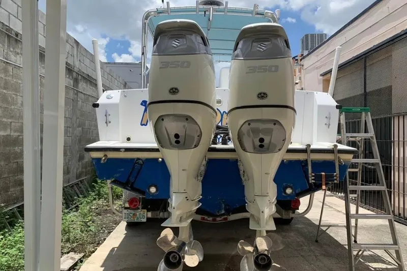 Slide: The Image of 1998 Contender 35 Express Side Console with twin Suzuki 350 outboard engines. - 9