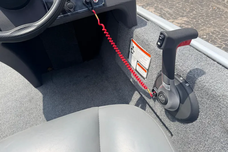 Slide: The Image of 2019 Bass Tracker III Classic boat throttle control with safety lanyard and warning labels. - 10