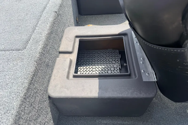 Slide: The Image of Bass Tracker III Classic 2019 boat storage compartment with textured interior. - 12