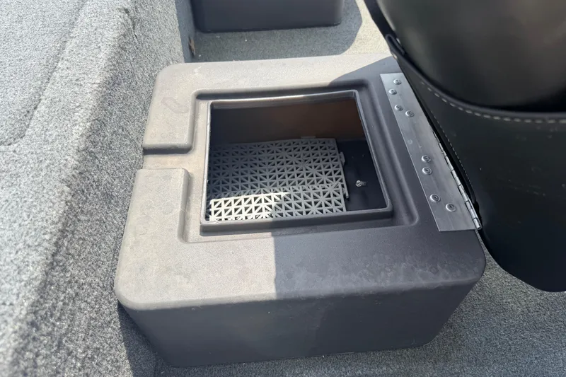 Slide: The Image of 2019 Bass Tracker III Classic boat storage compartment with textured interior. - 13
