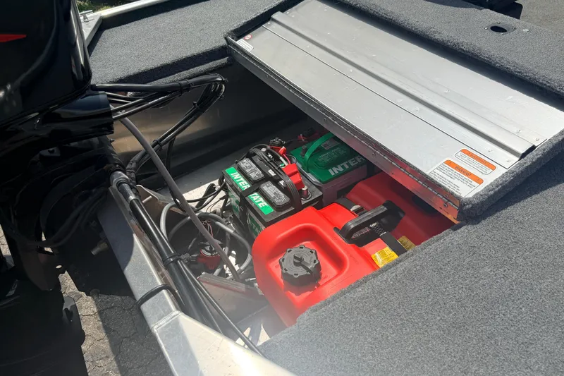Slide: The Image of 2019 Bass Tracker III Classic boat battery compartment with Interstate batteries and fuel tank. - 25
