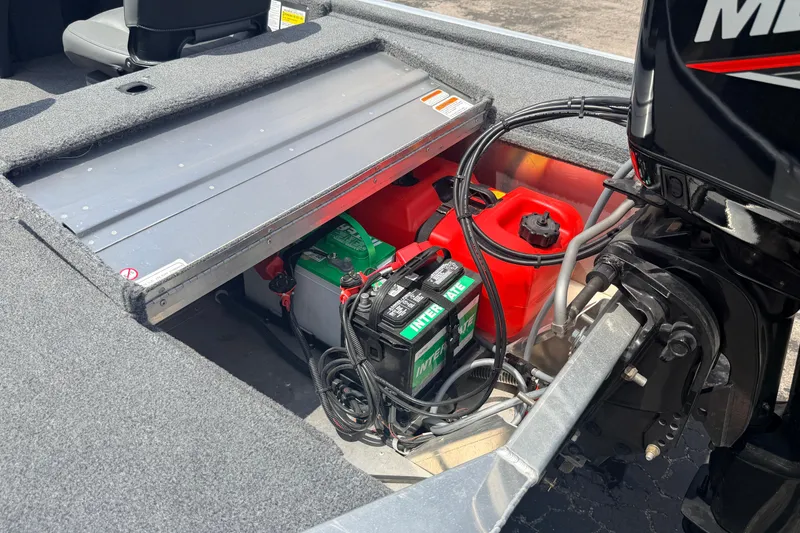 Slide: The Image of 2019 Bass Tracker III Classic boat battery and fuel storage compartment. - 26
