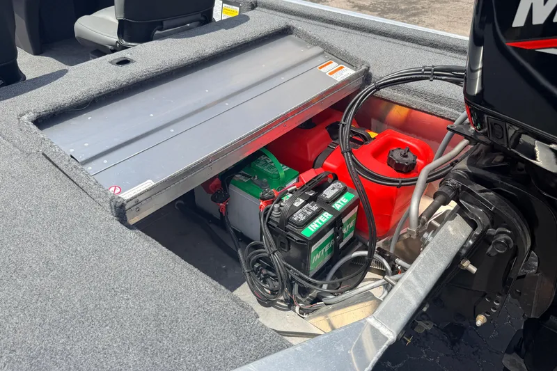 Slide: The Image of 2019 Bass Tracker III Classic boat battery and fuel storage compartment. - 27