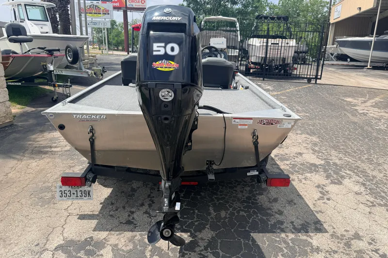 Slide: The Image of 2019 Bass Tracker III Classic boat with Mercury 50 engine, parked outdoors. - 3