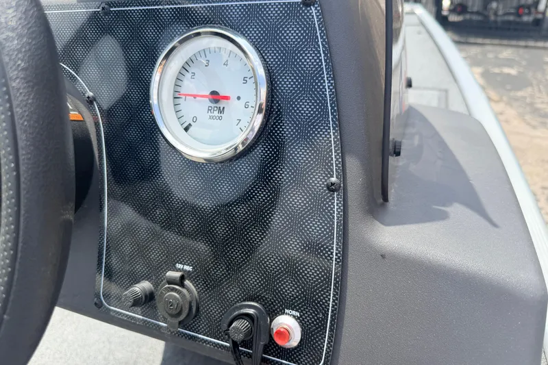 Slide: The Image of Dashboard of a 2019 Bass Tracker III Classic boat with RPM gauge and controls. - 8