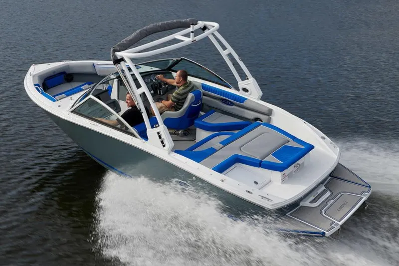 Slide: The Image of Manufacturer Provided Image: 2021 Cobalt CS22 boat cruising on water with two passengers. - 11