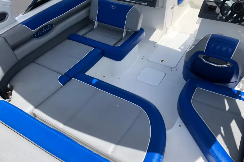 Slide: The Image of 2021 Cobalt CS22 boat interior with blue and gray seating. - 17