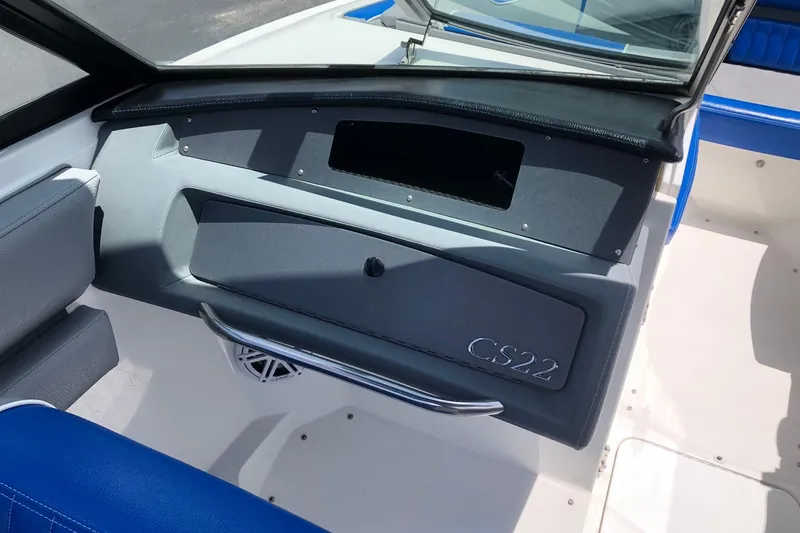 Slide: The Image of Interior of a 2021 Cobalt CS22 boat, featuring sleek seating and dashboard design. - 19