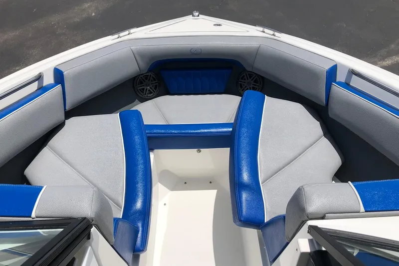 Slide: The Image of 2021 Cobalt CS22 boat interior with blue and gray seating arrangement. - 21